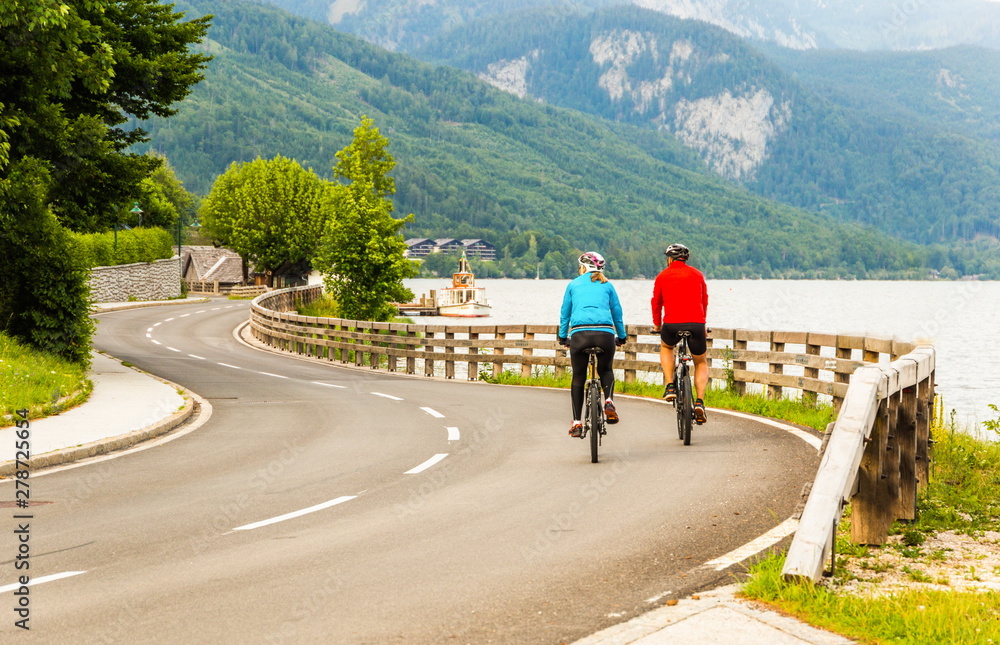 Fototapeta premium Road along the mountain lake. Summer evening. Austrian Alps.