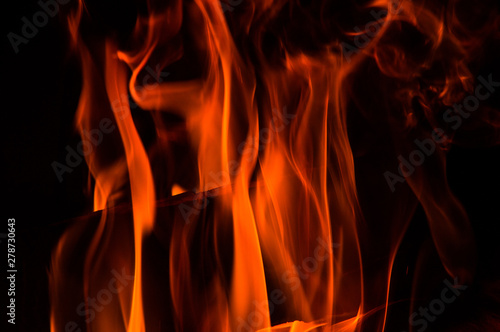 Close up. Abstrack background. Orange flames in the fireplace. Copy space.