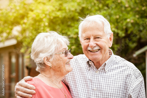 elderly senior couple hug each other