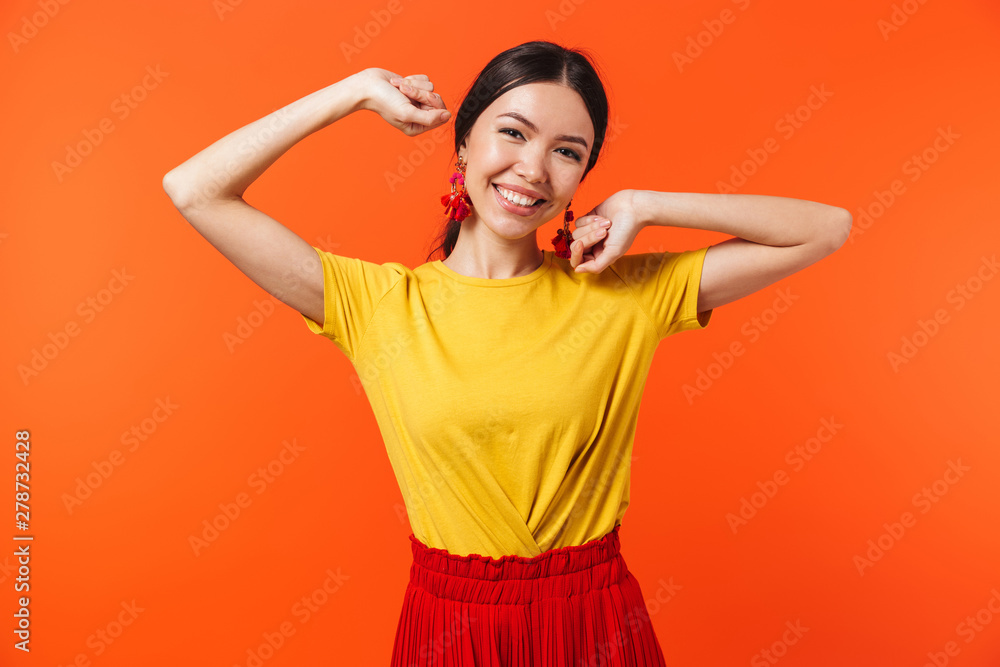Image of brunette hispanic woman 20s dressed in skirt laughing at camera Image of brunette hispanic woman 20s dressed in skirt laughing at camera