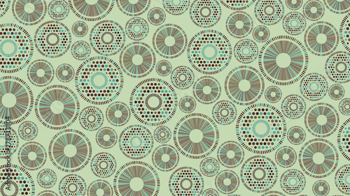 Geometric abstraction of non-intersecting color elements of a round shape evenly distributed on a green background.