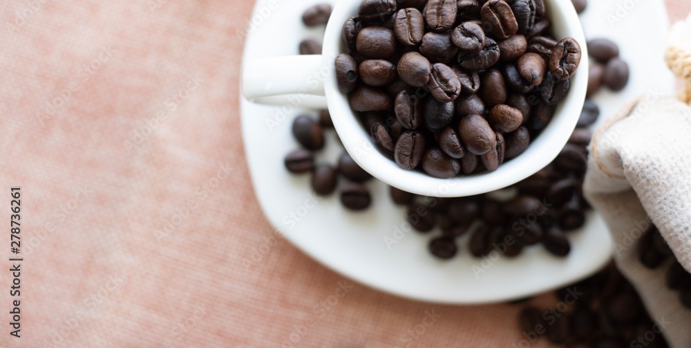 Cup filled with coffee beans. Cup filled with coffee beans.