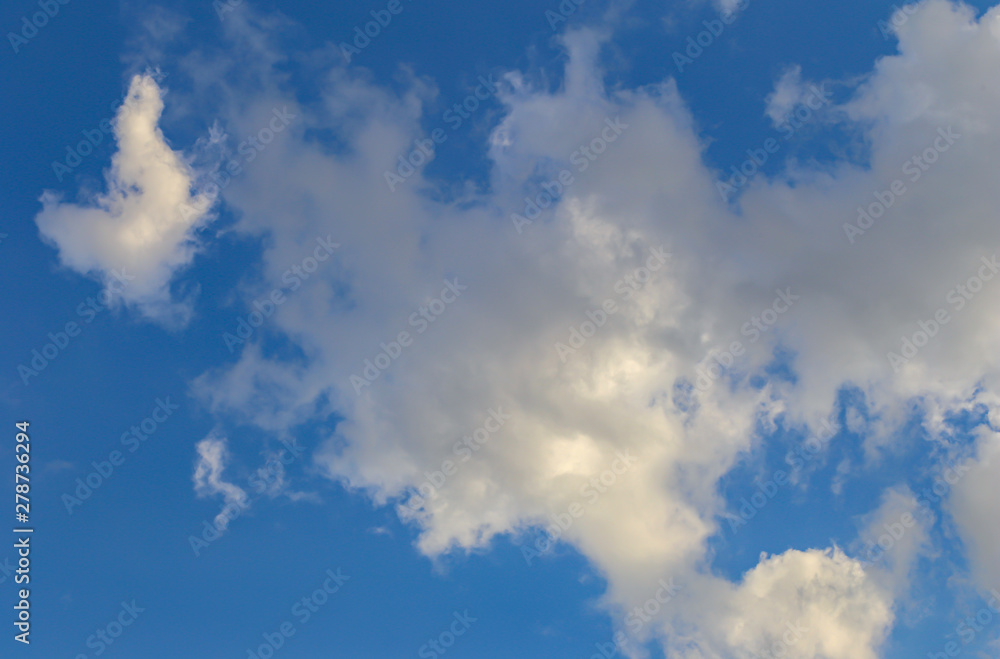 Obraz premium the blue sky background with tiny clouds