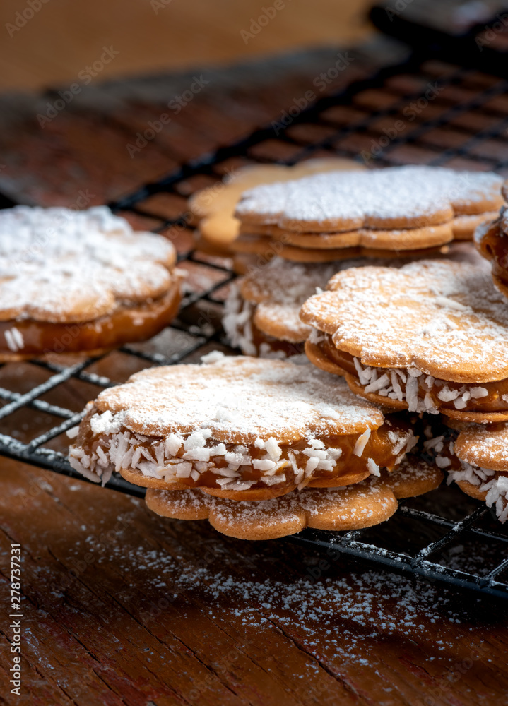 Freshly baked sandwich cookies filled with caramelized milk and coconut Freshly baked sandwich cookies filled with caramelized milk and coconut