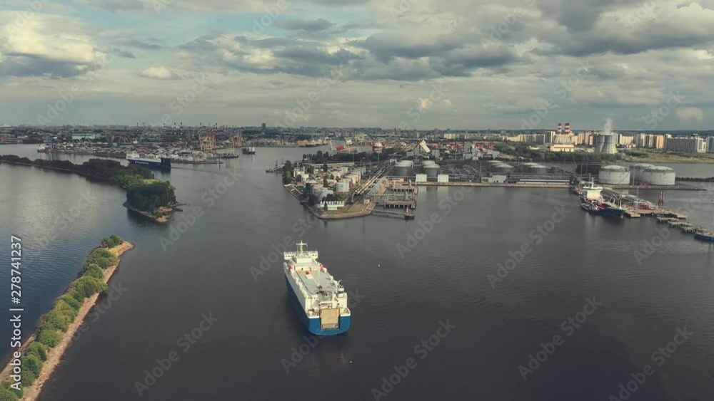 AERIAL. Container ship in export and import business and logistics. Shipping cargo to harbor by crane. Water transport International. Aerial view AERIAL. Container ship in export and import business and logistics. Shipping cargo to harbor by crane. Water transport International. Aerial view