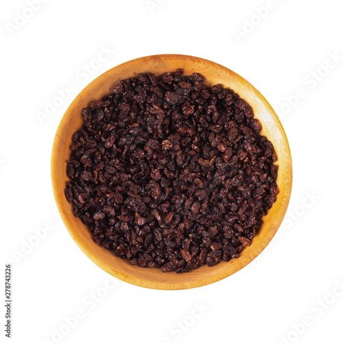 heap of dried red barberry in woodenplate isolated on white background. top view