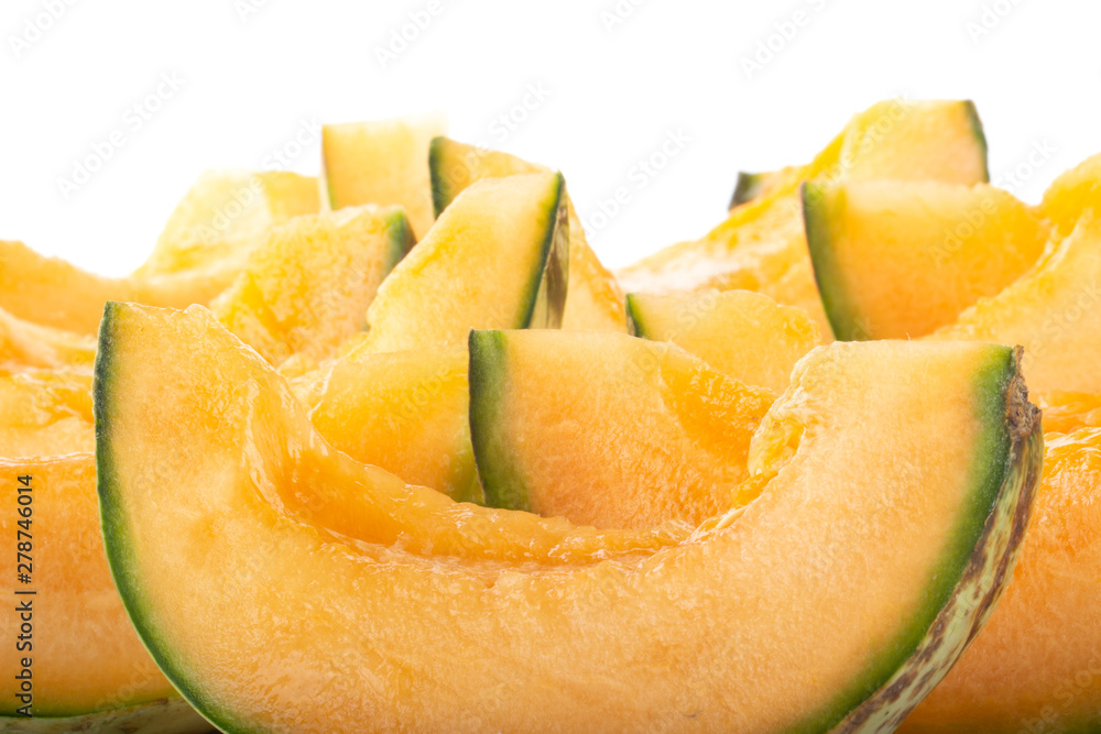 heap of slices of cantaloupe isolated on white background