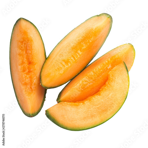 heap of slices of cantaloupe isolated on white background. top view