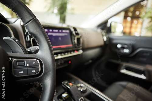 selective focus of steering wheel near gear shift handle in luxury car © sarymsakov.com