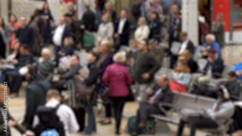 Crowd of Anonymous Travelers Waiting on Seats in Airport After Many Flights Got Cancelled