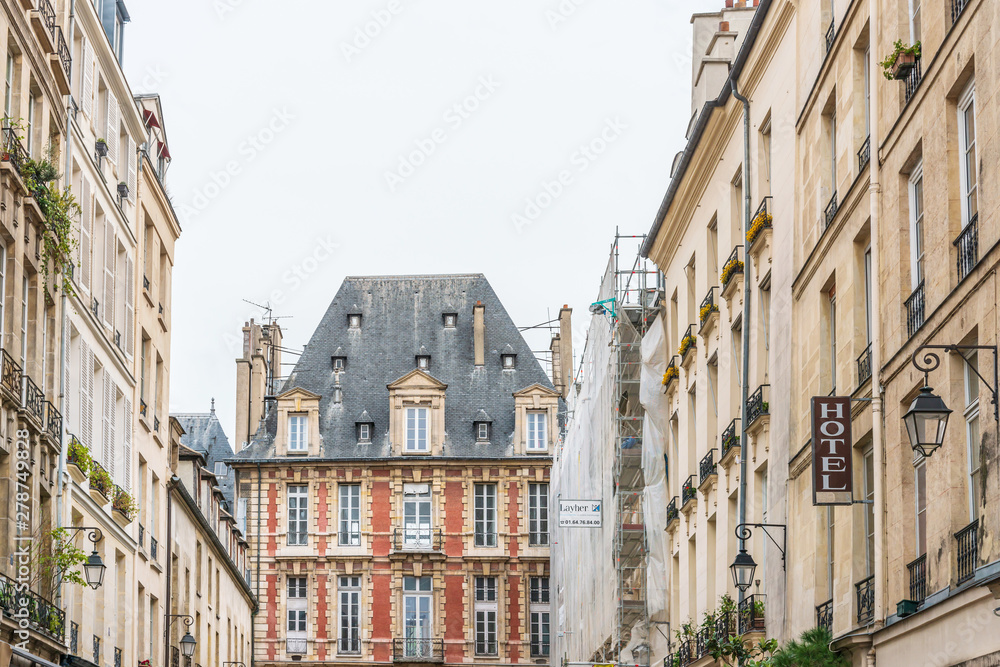 PARIS, FRANCE - APRIL 7, 2019: Antique building view in Paris city, France. PARIS, FRANCE - APRIL 7, 2019: Antique building view in Paris city, France.