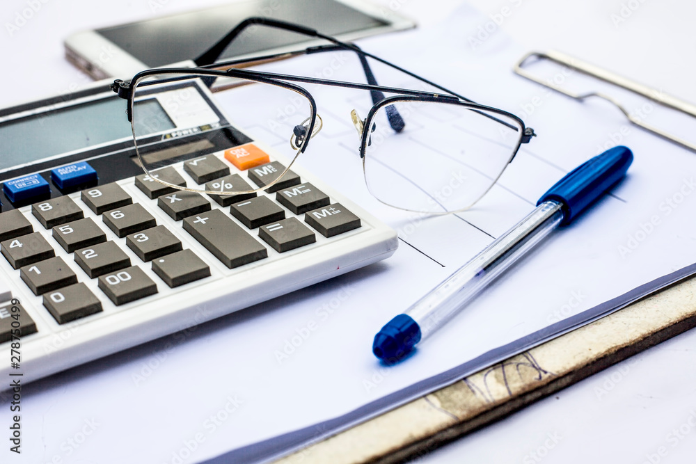 Close up of workplace of businessman or finance consultant isolated on white using credit card, cell phone, pen and calculator like things. Close up of workplace of businessman or finance consultant isolated on white using credit card, cell phone, pen and calculator like things.