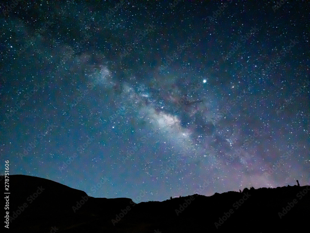 Naklejka Spectacular night scene of the Milky Way over the mountains
