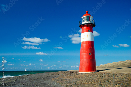 Vuurtoren Noorderhoofd lighthouse on deep blue sky