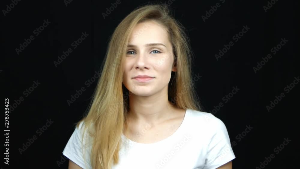 Young sad caucasian woman says no on black background Young sad caucasian woman says no on black background