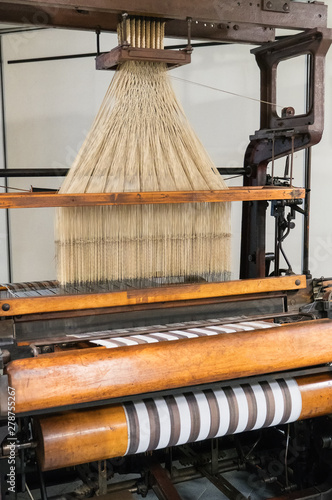 Retro mechanical loom with jacquard harness. photo