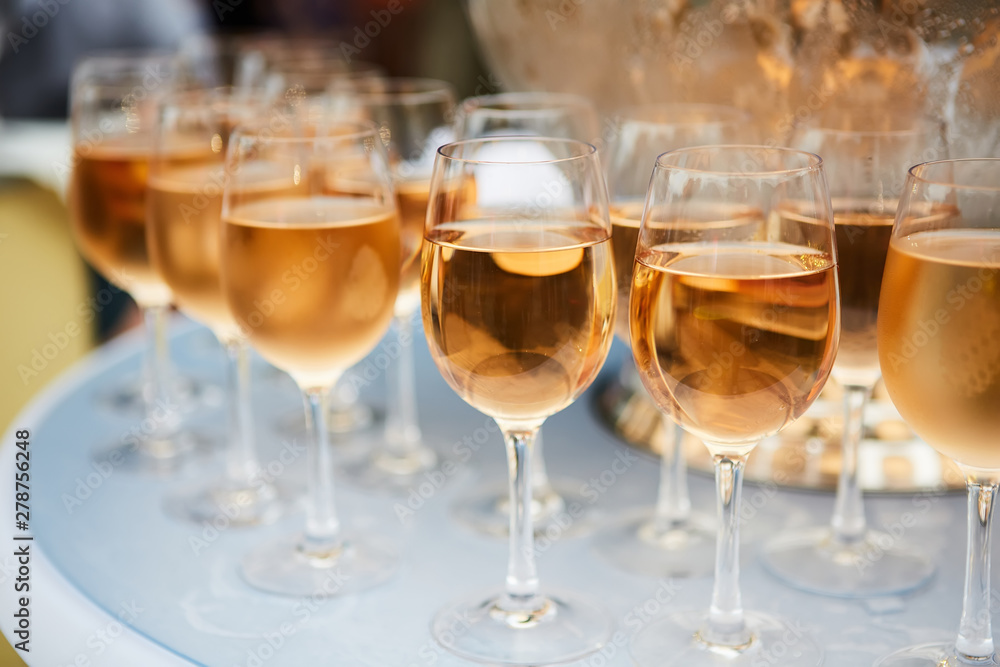 The beautiful wine glasses with rose wine The beautiful wine glasses with rose wine