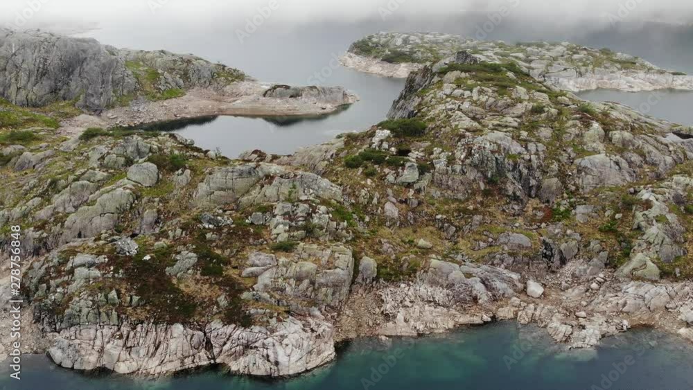 Aerial view. Lakes in stone rocky mountains, misty foggy day. Norway summer landscape. Norwegian national tourist scenic route Ryfylke Aerial view. Lakes in stone rocky mountains, misty foggy day. Norway summer landscape. Norwegian national tourist scenic route Ryfylke