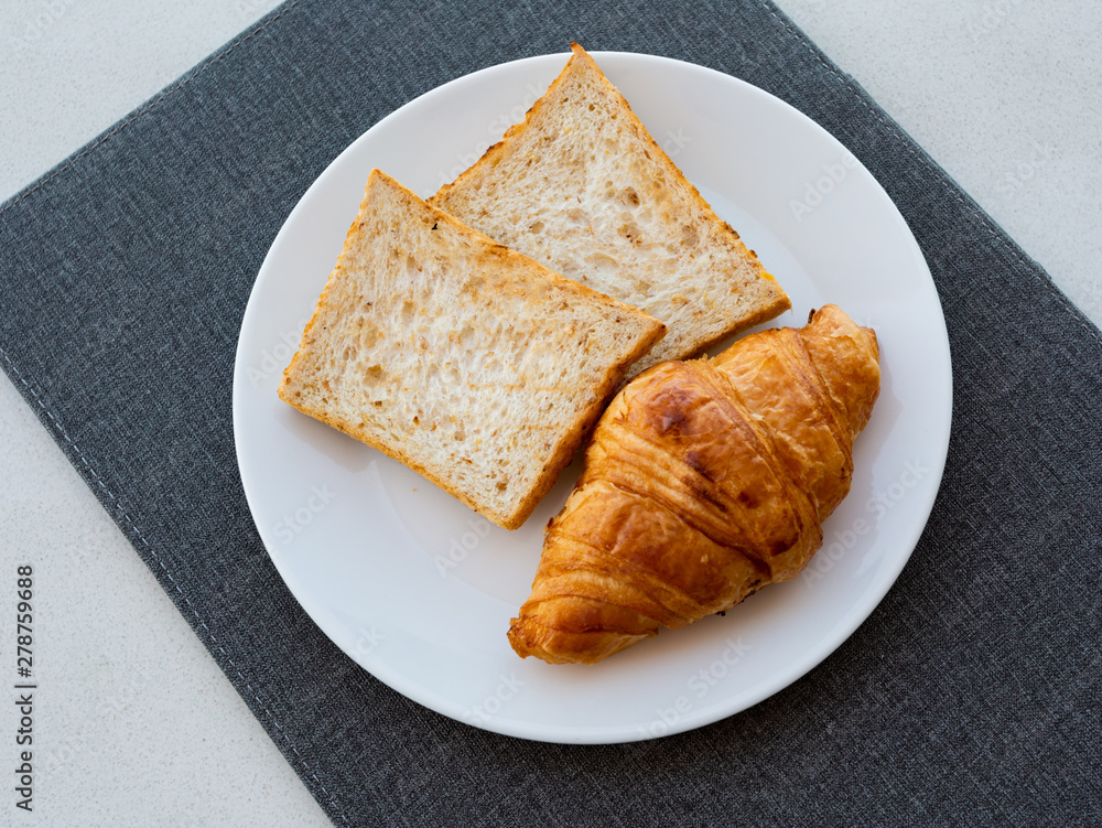 bread&croissant on a plate