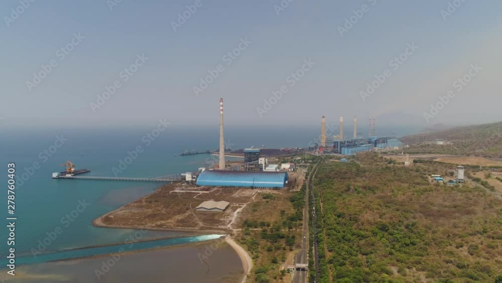 power station by sea with smoking pipes, paiton java, indonesia. aerial view power plant in asia. power station by sea with smoking pipes, paiton java, indonesia. aerial view power plant in asia.