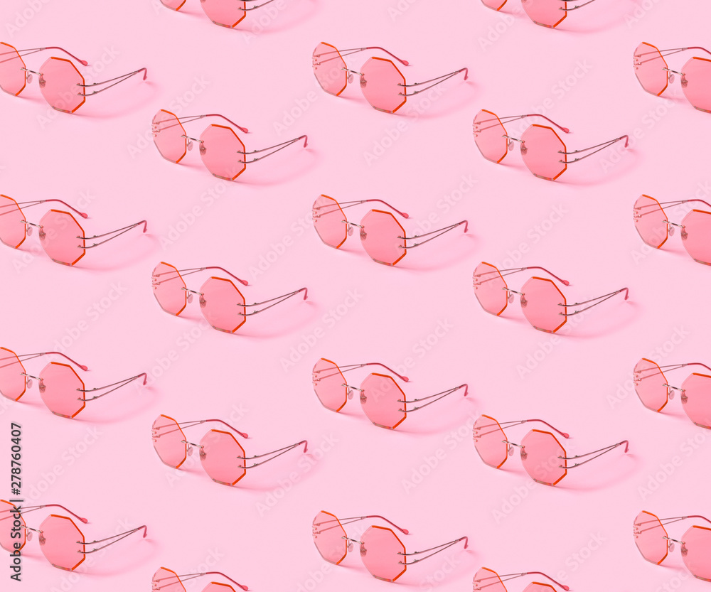 Creative pink trendy sunglasses pattern on pastel background Stock