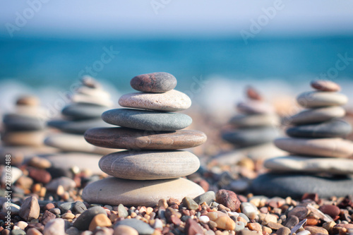 Stones tower with blurred sea background. Zen garden. Spa set.  Your text space. 