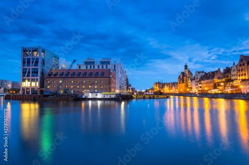 Beautiful old town in Gdansk over Motlawa river at dusk, Poland