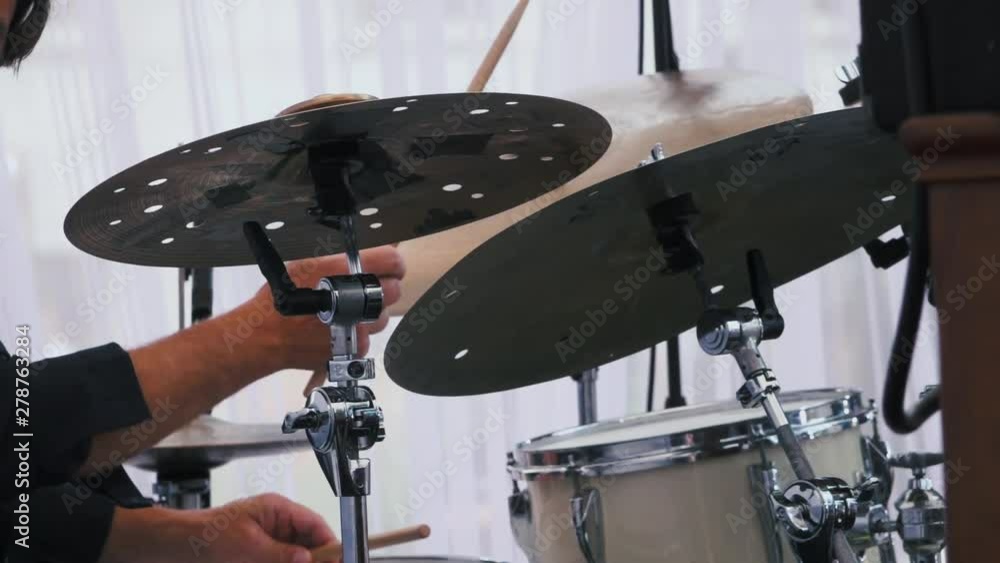 Slow motion shot of a musician performing on drums on festival Slow motion shot of a musician performing on drums on festival