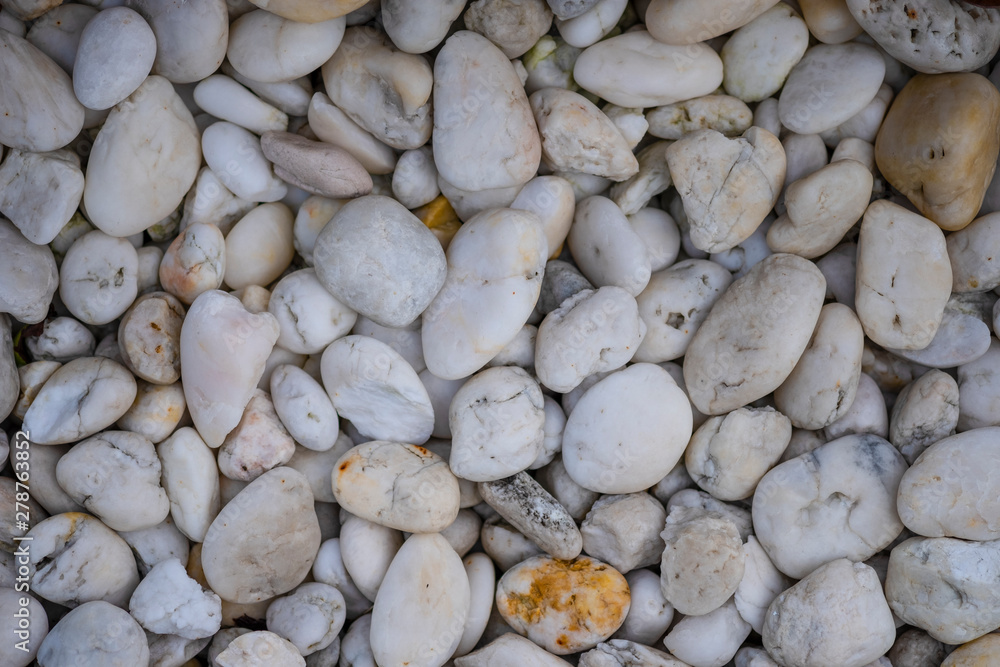 White pebbles for background and texture. Rock or stone pebble is sign of spa and zen religion. White pebbles for background and texture. Rock or stone pebble is sign of spa and zen religion.
