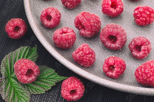 Ripe raspberries on a plate
