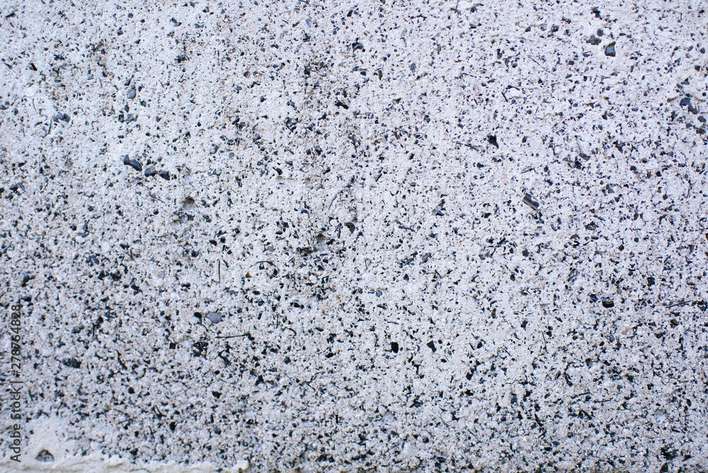 Obraz premium Detail of a gray wall close up. Cinderblock garage, detailing the outside of the garage wall