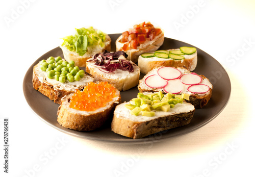 sandwiches or tapas prepared with bread and tasty ingredients. Could be nice food for healthy breakfast ot lunch. Copy space for your text