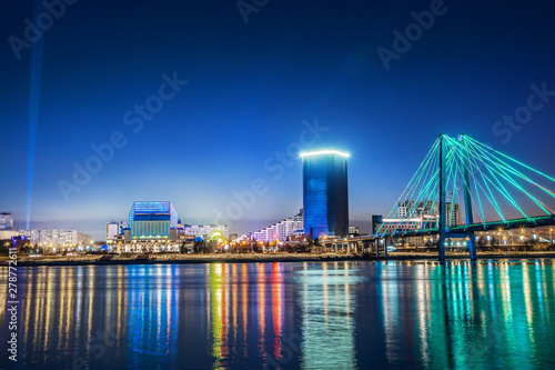 Evening and night Krasnoyarsk, panorama night city. Cable-stayed bridge in bright lights. Urban landscape. photo