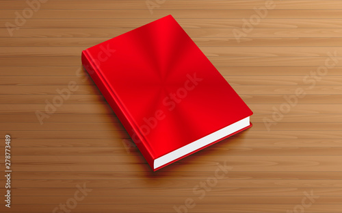 red book on the wooden table