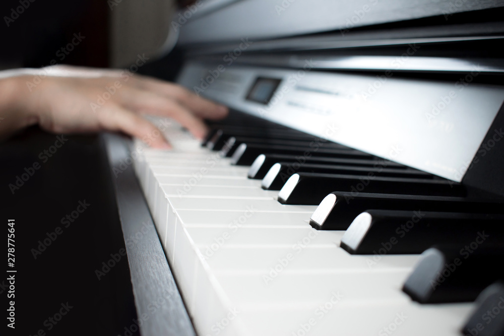 Blurred images of musicians' hands playing the piano. Blurred images of musicians' hands playing the piano.