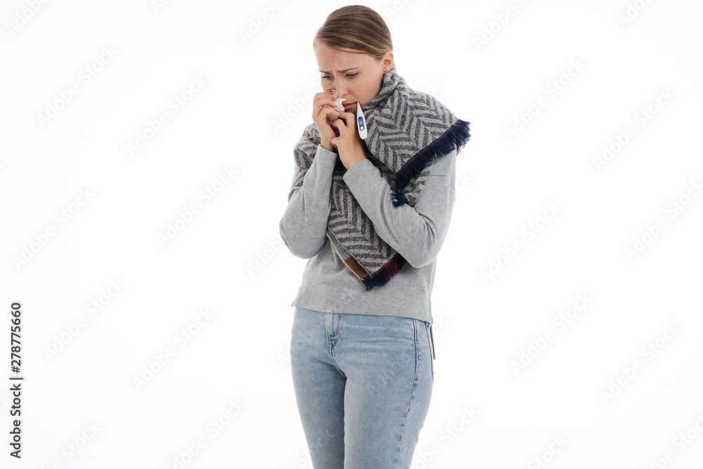 Young sick woman wrapped in a scarf on white background. Cold, flu, illness. Young sick woman wrapped in a scarf on white background. Cold, flu, illness.
