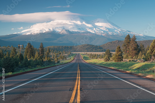 Road towards Mounts Shasta and Shastina in California, United States Highway 97 in Northern California heading South toward a mountain called Shasta volcano, USA