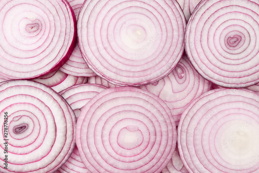 Onion slices as a background. Top view. Onion slices as a background. Top view.