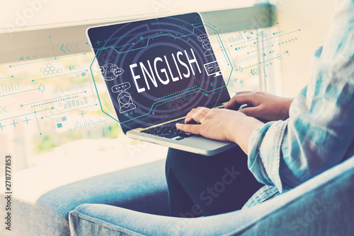 English concept with woman using her laptop in her home office