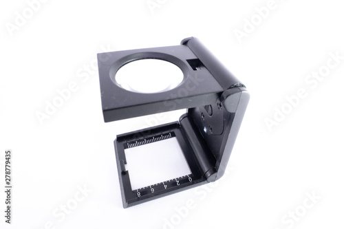 Loupe or pocket magnifier on white background