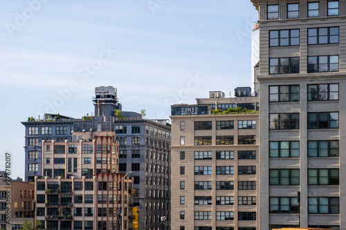 Dumbo buildings view from Brooklyn Bridge in summer sunny daylight