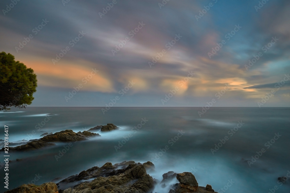 Obraz premium Beautiful sunset light in Costa Brava of Spain, near town Palamos, long exposure picture