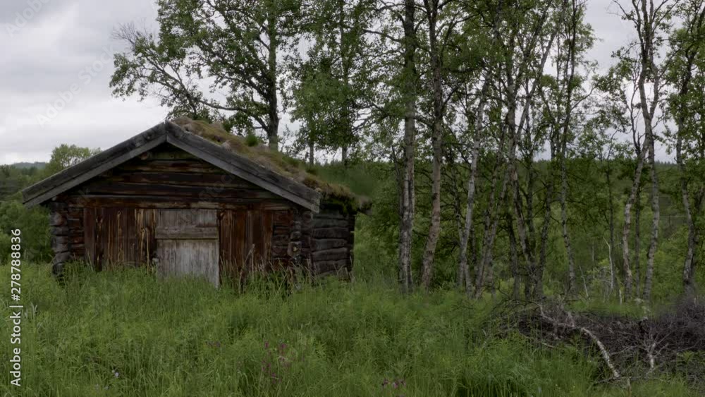 Gorgeous static shot of a wooden shed in a rural setting. Gorgeous static shot of a wooden shed in a rural setting.