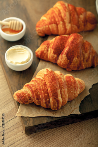 Tasty croissants French on a wooden background Coffee