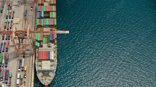 Aerial drone photo of industrial cargo area with cranes, container ships and logistics, Piraeus port, Drapetsona, Perama, Attica, Greece photo