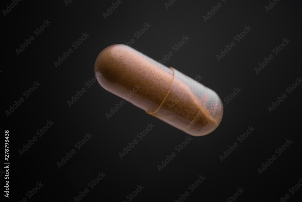 Floating or levitate Transparent capsule pills in the thin air Floating or levitate Transparent capsule pills in the thin air