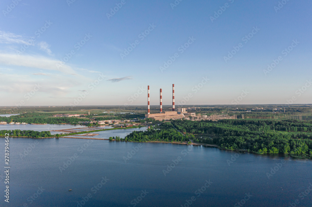 Scenic aerial view of the largest thermal power plant in Europe. Beautiful summer sunny look of big electricity station in sunset light