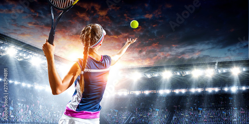 Young woman playing tennis in action © Sergey Nivens