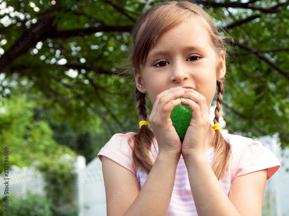 Little cute girl plays in the popular toy anti-stress for hands, chewing gum for hands, slime. Metalic color. Games for children and adults. Free space for text. Little cute girl plays in the popular toy anti-stress for hands, chewing gum for hands, slime. Metalic color. Games for children and adults. Free space for text.