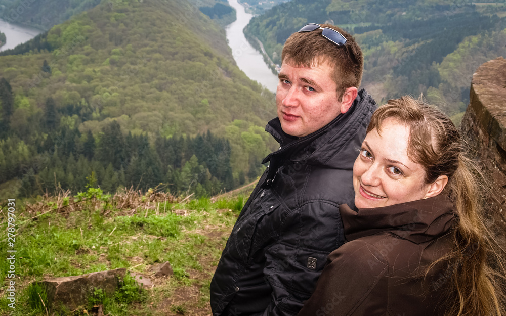 Young people in love travel to interesting places in Europe in autumn